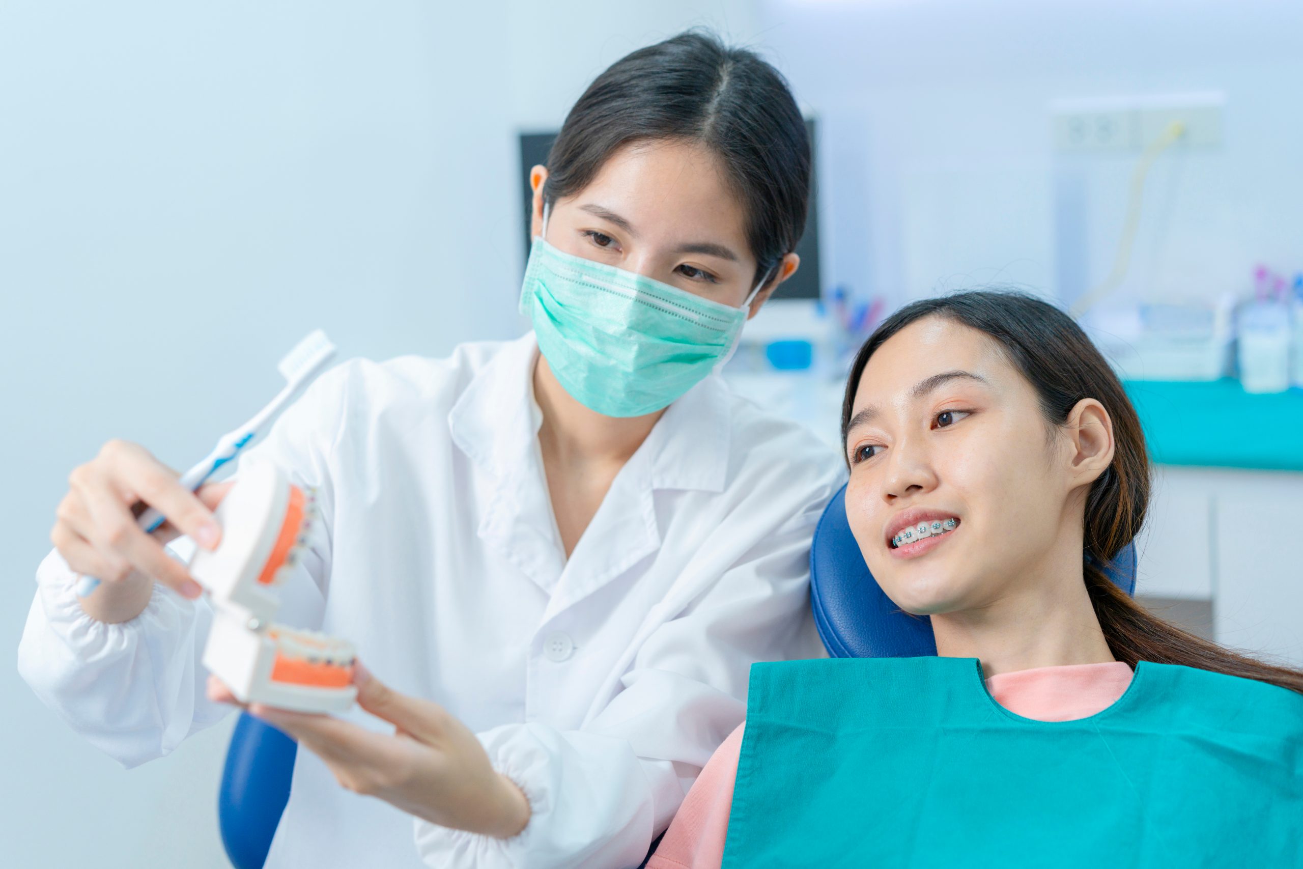 woman consulting dentist about invisalign alternatives